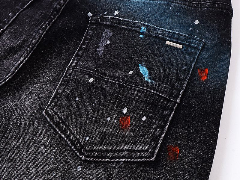 AMIRI Paint Splatter Distressed Black Jeans — detail